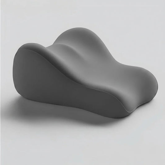 Pure Motion dark gray ergonomic memory foam leg elevation pillow with a contoured design for back and knee support.