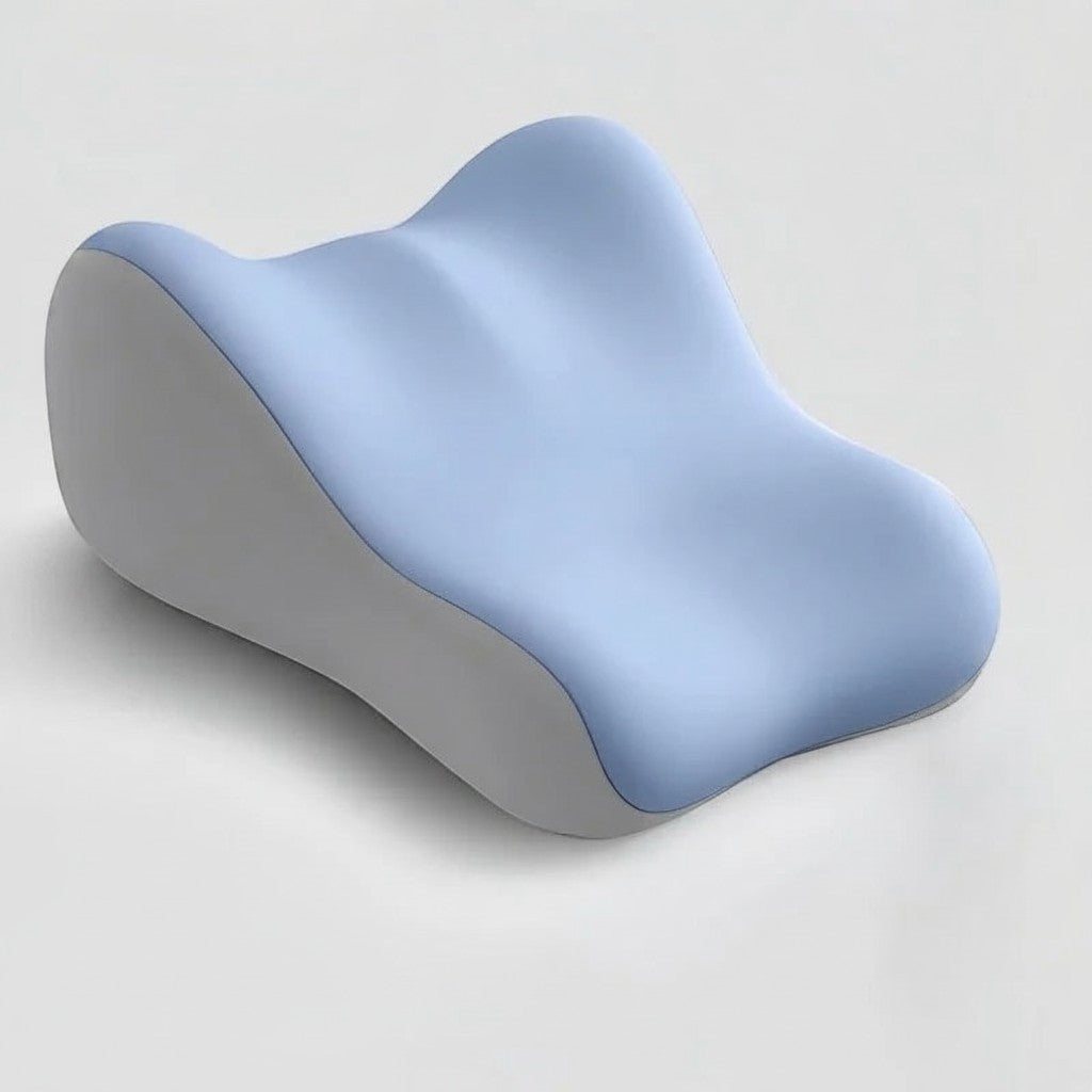 Pure Motion memory foam leg elevation pillow in sky blue with a contoured ergonomic design for back and knee relief.