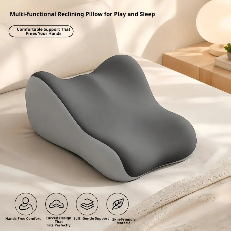 Pure Motion memory foam leg elevation pillow in dark gray with a contoured ergonomic design for back and knee relief.